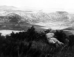 A marine infantryman keeps cover