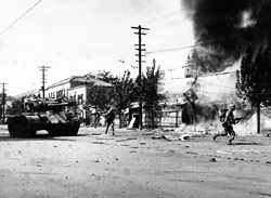 Marine infantry lead an M26 tank