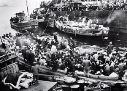 Civilians carried to South Korea board ships for the journey