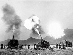 A battery of 155mm Long Tom rifles fire north of Seoul in May, 1951