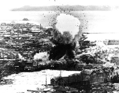 Supply warehouses at the east-coast port of Wonsan are bombed in July, 1951